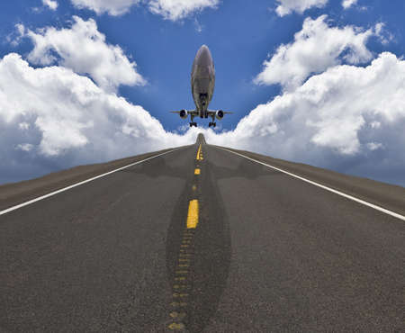 Airplane landing on road in the sky の写真素材