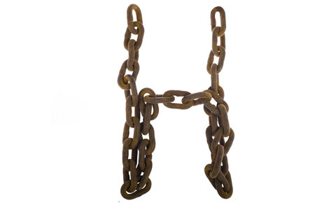 Letter H from rusty chain alphabet isolated on white  