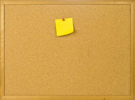 Cork posting board with blank note の写真素材