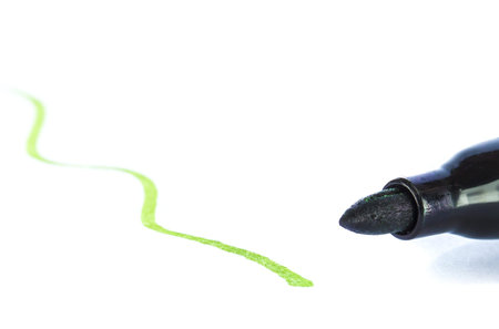 Marker drawing line on white background