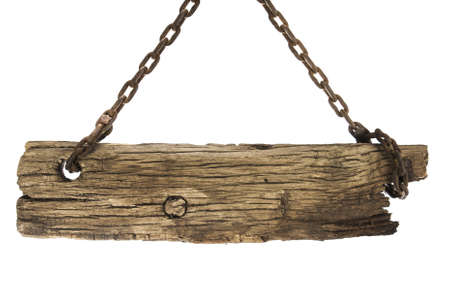 Vintage blank sign board hanging by rusty chainsの写真素材