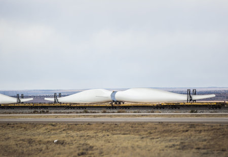 Transporting windmill blades by railroadの写真素材