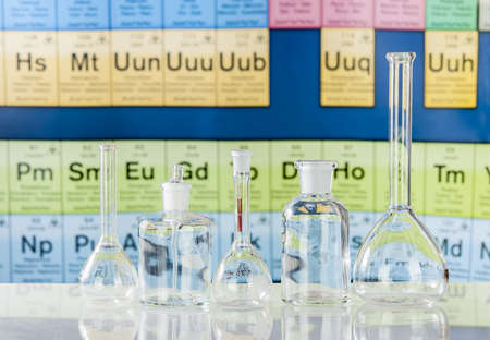 Laboratory glassware with chemical chart backgroundの写真素材