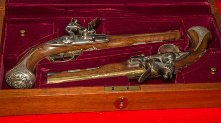 Rendered set of antique duelling pistols with case