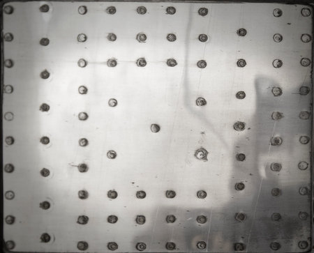 Metal patch with rivets