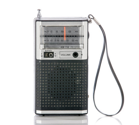 Vintage era transistor radio isolated on a white background.の写真素材