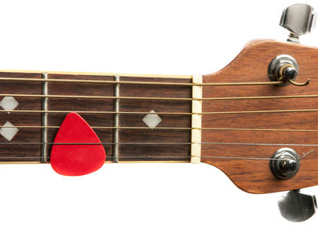 Acoustic Guitar neck and pick with white background