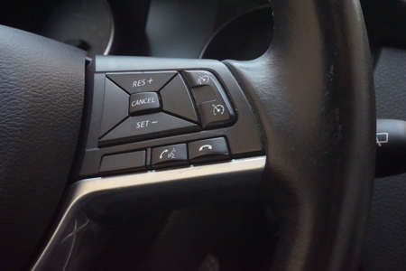 Modern steering wheel with multi-function buttons for quick control,Close up interior modern Black interior Comfortable Car.の写真素材