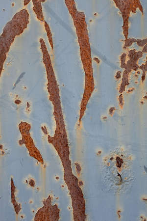 rust corrosion on a large varnished metal sheetの写真素材