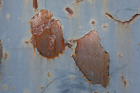 rust corrosion on a large varnished metal sheetの写真素材