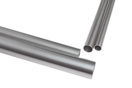 four brushed steel pipes in diagonal position, isolated over whiteの写真素材