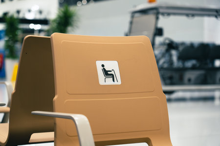 Disable chair seats in a new airport with nobodyの写真素材