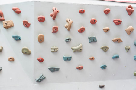 Colorful climbing holds at indoor climbing enthusiasts and gymの写真素材