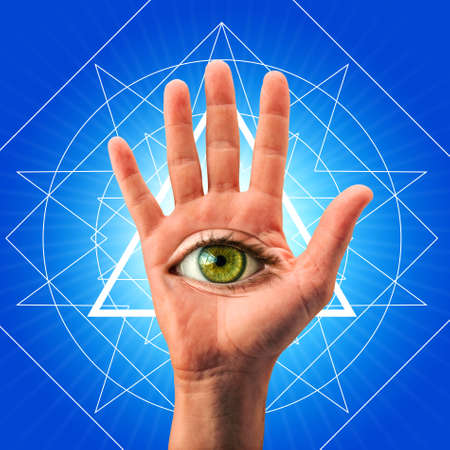 Eye in the palm of the hand. Spiritual symbol concept.の写真素材