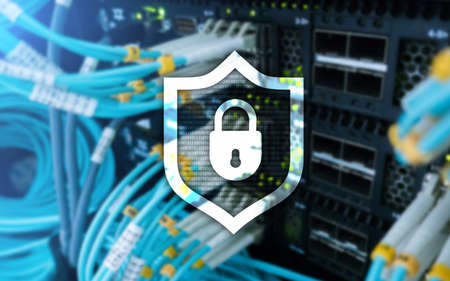 Cyber protection shield icon on server room background. Information Security and virus detection.の写真素材