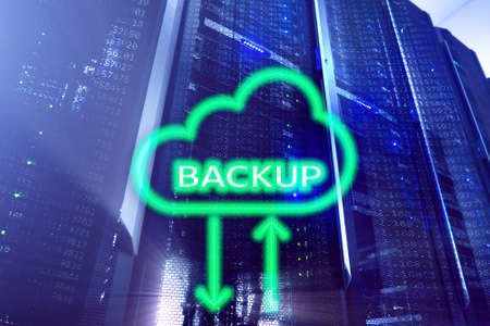 Backup button on modern server room background. Data loss prevention. System recovery. の写真素材