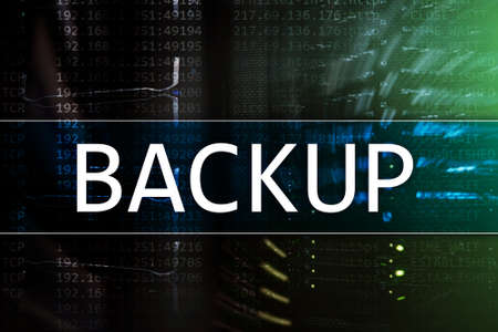 Backup button on modern server room background. Data loss prevention. System recovery.の写真素材