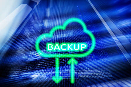 Backup button on modern server room background. Data loss prevention. System recovery.の写真素材