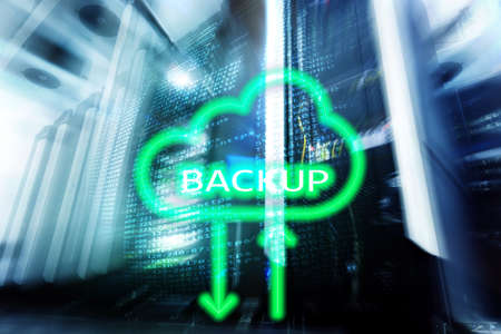 Backup button on modern server room background. Data loss prevention. System recovery.の写真素材