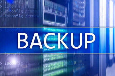 Backup button on modern server room background. Data loss prevention. System recovery.の写真素材