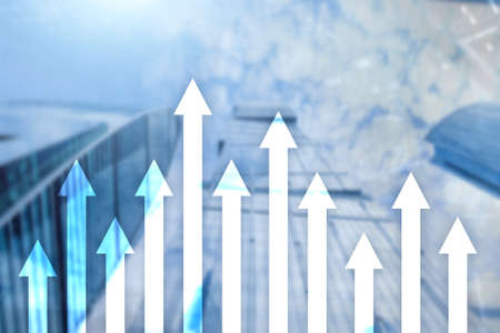 Up arrow graph on skyscraper background. Invesment and financial growth concept.の写真素材