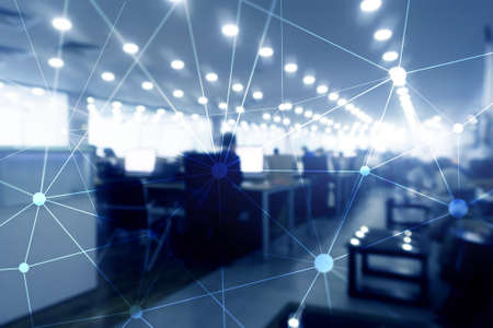 Blockchain network on blurred skyscrapers background. Financial technology and communication concept.の写真素材