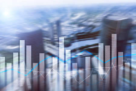 Financial graphs and charts on blurred business center background. Invesment and trading concept.の写真素材