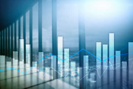 Financial graphs and charts on blurred business center background. Invesment and trading concept.の写真素材