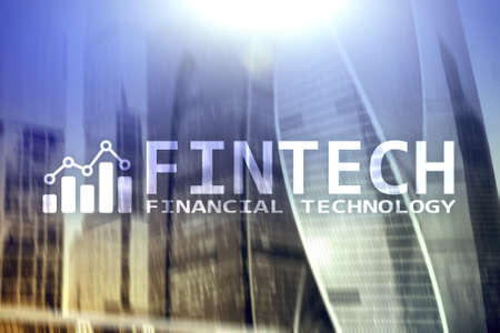 FINTECH - Financial technology, global business and information Internet communication technology. Skyscrapers background. Hi-tech business concept.の写真素材
