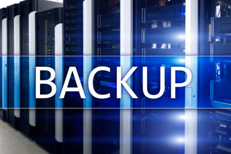 Backup button on modern server room background. Data loss prevention. System recovery.の写真素材