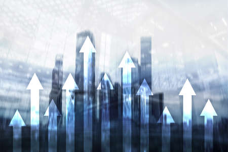 Up arrow graph on skyscraper background. Invesment and financial growth concept.の写真素材
