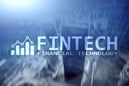 FINTECH - Financial technology, global business and information Internet communication technology. Skyscrapers background. Hi-tech business concept.の写真素材