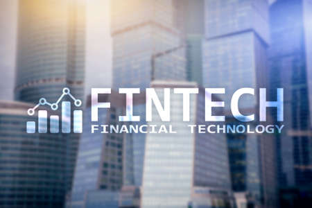 FINTECH - Financial technology, global business and information Internet communication technology. Skyscrapers background. Hi-tech business concept.の写真素材