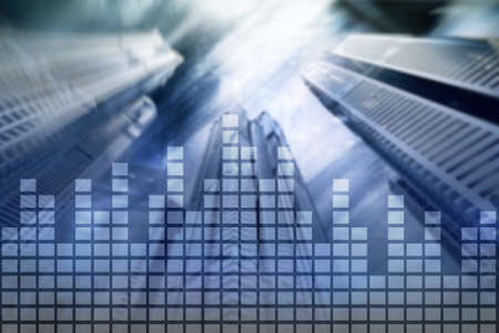 Financial chart on blurred skyscraper office background.の写真素材