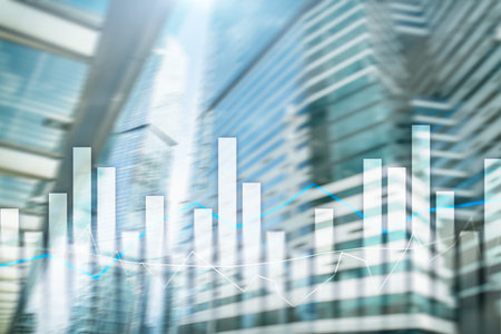 Financial graphs and charts on blurred business center background. Invesment and trading concept.
