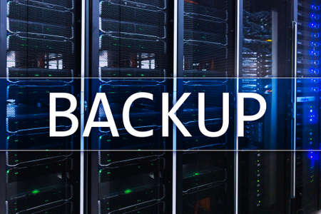 Backup button on modern server room background. Data loss prevention. System recovery.の写真素材