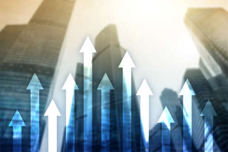Up arrow graph on skyscraper background. Invesment and financial growth concept.の写真素材