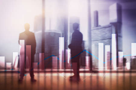 Financial graphs and charts on blurred business center background. Invesment and trading concept.の写真素材