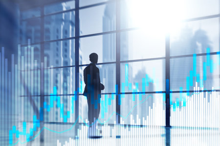 Stock trading candlestick chart and diagrams on blurred office center background.