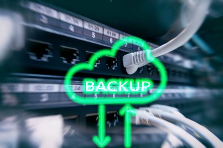 Backup button on modern server room background. Data loss prevention. System recovery.