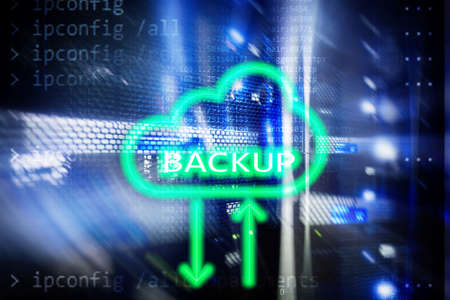 Backup button on modern server room background. Data loss prevention. System recovery.の写真素材