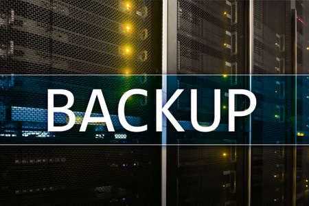 Backup button on modern server room background. Data loss prevention. System recovery.の写真素材