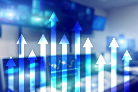 Up arrow graph on skyscraper background. Invesment and financial growth concept.の写真素材