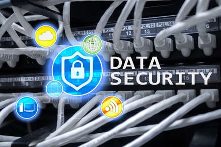 Data security, cyber crime prevention, Digital information protection. Lock icons and server room background.の写真素材