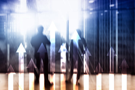 Up arrow graph on skyscraper background. Invesment and financial growth concept.の写真素材
