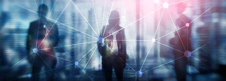 Blockchain network on blurred skyscrapers and people background. Financial technology and...