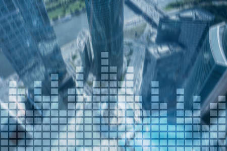 Financial chart on blurred skyscraper office background.