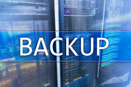 Backup button on modern server room background. Data loss prevention. System recovery.の写真素材