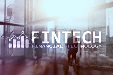 FINTECH - Financial technology, global business and information Internet communication technology. Skyscrapers background. Hi-tech business concept.の写真素材