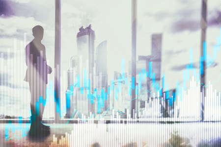 Stock trading candlestick chart and diagrams on blurred office center background.の写真素材